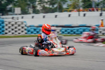 The team in the Top10 with Lee at the Macau International Kart Grand Prix .